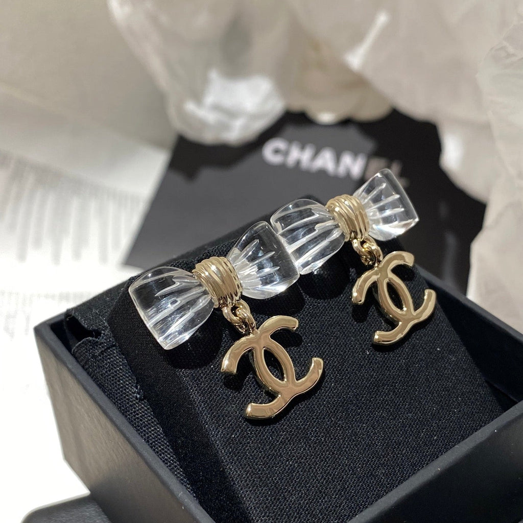 Chanel Transparent Acrylic Bow Gold Earrings